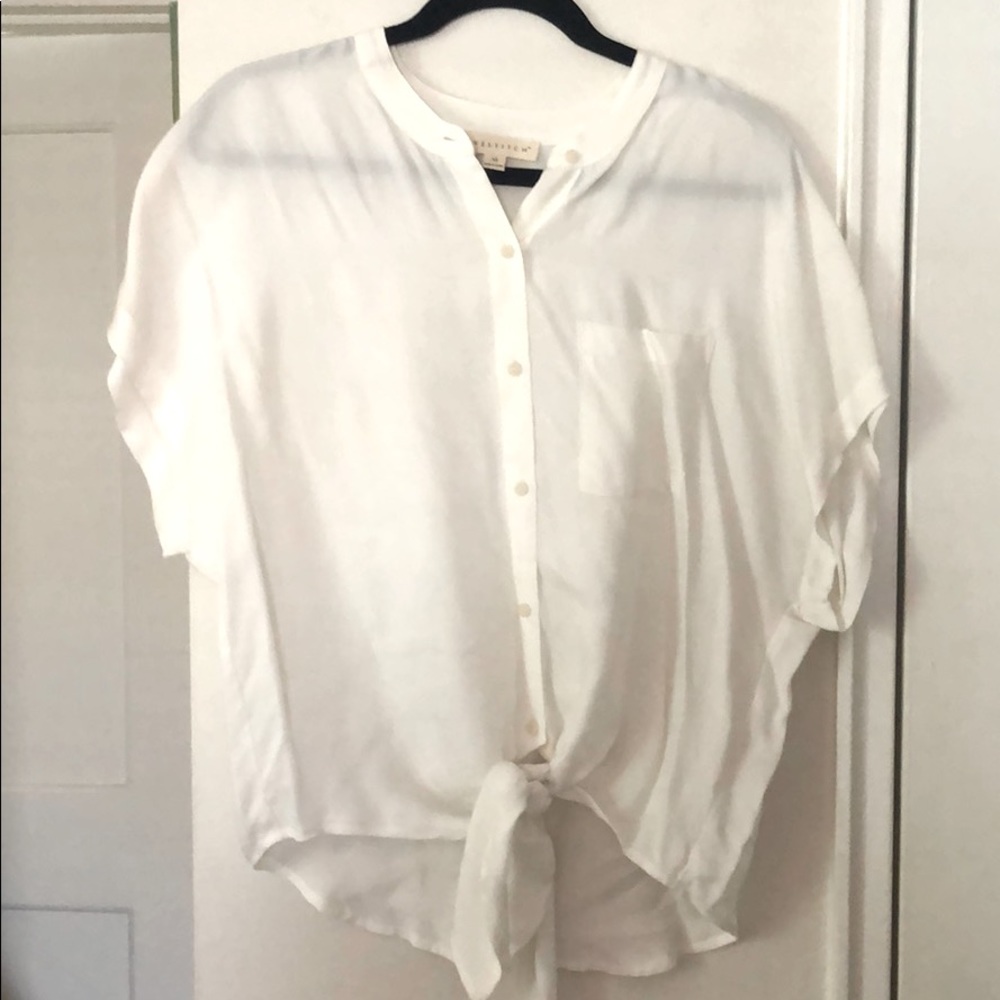 White LoveStitch blouse with tie bottom